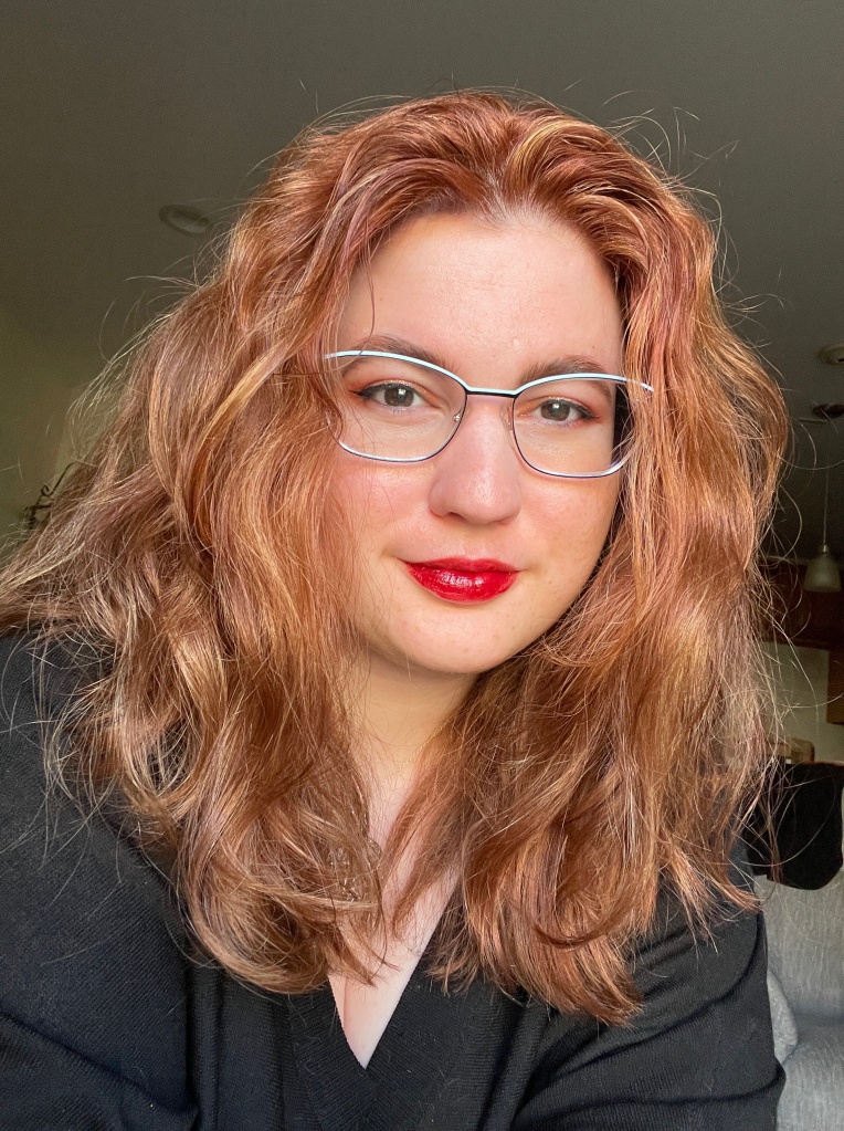Abigail “Abby” Shisslak, co-leader, organizer, and tech support person for the EDS and CTD New England/MA Support Group, is a caucasian woman with long shoulder-length strawberry-blonde hair. She has a relaxed smile and shining eyes.